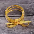 5-piece set of yellow seed bead silicone jelly bangles with decorative ribbon bow - 5 Pieces / Yellow