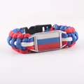 Handmade paracord woven survival bracelet featuring a Russian flag emblem and black buckle - Alloy Buckle / Russia