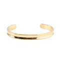 Detailed view of 7mm gold stainless steel C-shaped cuff bracelet with polished finish - Gold