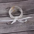Elegant 5-piece set of white silicone seed bead bracelets tied with a satin ribbon - 5 Pieces / White
