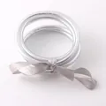 Set of premium flexible silver PVC jelly bangles with elegant grey ribbon bow tie. - Silver