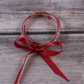 Set of three red glitter silicone jelly bangles decorated with a silk ribbon bow - 3-Layer Set / Red