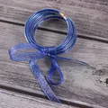 Set van 5 blauwe glitter siliconen armbanden met bijpassende metallic strik. - 5 Stuks / Blauw (JB604)