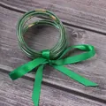 Stylish set of seven green glitter silicone jelly bangles with a green ribbon - Green