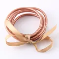 Rose gold PVC silicone jelly bangles set tied with an elegant tan ribbon bow - Rose Gold