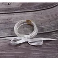 Set of clear silicone jelly bangles filled with white seed beads tied with a satin ribbon - 5 Pieces / White