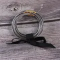Set of five transparent silicone bangles with black beads and a decorative black ribbon bow - 5 Pieces / Black