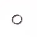 Close-up view of a minimalist 3mm black silicone jelly ring on a white background. - Size 6 / Black