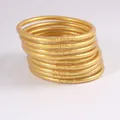 Ein schönes Set aus 9 flexiblen goldenen Jelly-Armreifen mit einem Glitzer-Finish - 9er Set / Hellgold