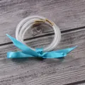 Elegant 5-piece set of transparent silicone glitter bangles featuring a blue ribbon - 5 Piece Set / Sky Blue