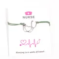 Handmade nurse themed green wax cord bracelet with stethoscope heart charm on card - Dark Green