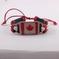 Handcrafted braided leather bracelet featuring a classic Canadian flag maple leaf charm - Canada