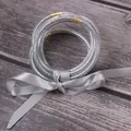 Set of 7 silver glitter silicone jelly bangles with an elegant grey ribbon bow - Silver