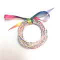 Braccialetti in silicone trasparente a 5 strati con perline e fiocco arcobaleno - Set a 5 Strati (JB618) / Perline Colorate Arcobaleno
