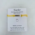 Yellow waxed cord teacher wish bracelet with engraved Teach metal bar on white card - TEACH Letter Style / Yellow