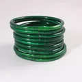 A stack of nine translucent green jelly bangles made from flexible PVC silicone tubing - 10 Pieces Set / Green