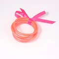 Fluorescent orange jelly bangles made of PVC silicone tube tied with pink ribbon - 65mm / 6mm / Orange Rose Red