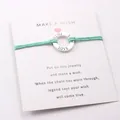 Detail of FAITH Hope LOVE alloy ring bracelet on mint green wax cord with wish card - Light Blue
