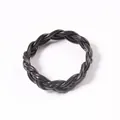 Black braided PVC twist bracelet with 6-strand rope design for stacking styles. - Black