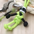 Handgemaakte paracord pop sleutelhanger in de kleuren neon groen en diep zwart tint - Helm Fluorescerend Touw