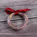 Set of 5 flexible silicone bangles with colorful seed beads and a decorative red ribbon bow - 5 Pieces / Mixed Wine Red Beads