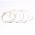 Set of 4 elegant white braided jelly bangles made of flexible PVC silicone material - Set of 4 / White