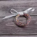 Set of 5 clear silicone bangles filled with colorful seed beads and a white ribbon bow - 5 Pieces / Mixed Beads White