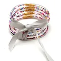Set di 5 braccialetti in silicone jelly con perline colorate e fiocco in nastro argento - Set a 5 Strati (JB618) / Perle Color Argento