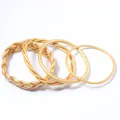 Set of 4 gold foil jelly bangles featuring braided and smooth silicone tube designs - Set of 4 / Gold
