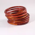 Set mit 9 orangefarbenen PVC-Jelly-Armreifen, modische flexible Stapel-Armbänder - 9er Set / Orangegold