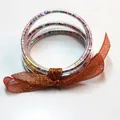 Set di 5 braccialetti jelly glitterati colorati con fiocco in nastro arancione per donna - Set a 5 Strati (JB618) / Motivo Cuore (Colore Nastro Intercambiabile)