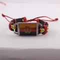 Handmade vintage East German DDR flag leather bracelet with red and yellow woven wax cord - East Germany