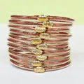 Set di 10 braccialetti glitter oro rosa scintillanti con eleganti chiusure a loto - Confezione da 10 / Rosa scuro