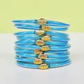 Set di 10 braccialetti Jelly glitterati blu con fibbie a forma di loto dorato - Confezione da 10 / blu brillante