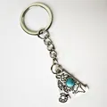 Detailed view of vintage silver stainless steel letter A keychain with turquoise inlay - Letter A