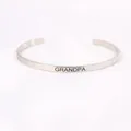 Detailed view of silver 4mm stainless steel cuff bracelet engraved with GRANDPA. - Grandpa