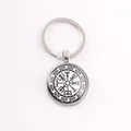 Close-up showing the intricate black and white Viking compass design under glass cabochon - Celtic Knot Compass / Silver
