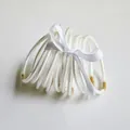 Set of 10 white glitter jelly bangles in PVC material tied with a white ribbon bow - 10 Pieces Pack / White