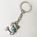 Retro silver stainless steel keychain featuring letter S with turquoise and floral patterns - Letter S
