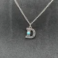 Vintage silver-stamped initial D necklace with turquoise stone and western motifs. - Letter D
