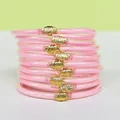 Détail de 9 bracelets en silicone à paillettes roses avec breloques lotus or - Rose