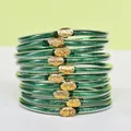 Stack of 10 green glitter silicone jelly bangles with golden lotus flower charms - 10 Pieces Pack / Green