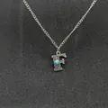 Vintage silver-tone initial necklace featuring turquoise stone and 'F' pendant detail - Letter F