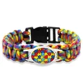 Detailed view of a multi-color puzzle pattern paracord bracelet with a black buckle closure - Jigsaw Puzzle