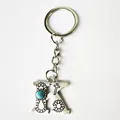 Vintage silver stainless steel letter K keychain with turquoise bead and floral engraving detail - Letter K