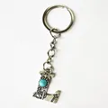 Retro silver stainless steel letter L keychain with turquoise stone and cowboy motifs - Letter L