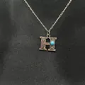Vintage silver letter H pendant necklace with turquoise stone and stamped cowboy icons - Letter H