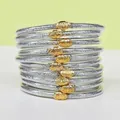 Set di 10 braccialetti jelly in argento glitterato con ciondoli decorativi a forma di loto dorato - Confezione da 10 / Argento