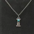 Vintage silver-toned necklace featuring a stamped turquoise letter I initial pendant - Letter I