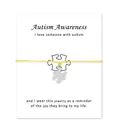 Handgemaakte verzilverde puzzelbedelarmband met een geel koord en Autism-kaarten - Geel